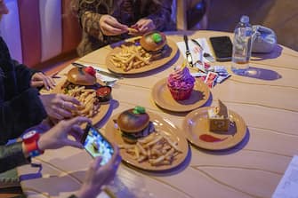 Guests take photos of their meals inside Toadstool Cafe during a media preview of Super Nintendo World theme park at Universal Studios Hollywood in Universal City, California, US, on Thursday, Feb. 16, 2023. The interactive replica of Nintendo Co.'s lands and characters will open to the public on February 17. Photographer: Kyle Grillot/Bloomberg via Getty Images