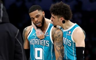 CHARLOTTE, NORTH CAROLINA - NOVEMBER 20: LaMelo Ball #1 of the Charlotte Hornets (R) celebrates with Miles Bridges #0 after a three-pointer during the second half of an NBA game at Spectrum Center on November 20, 2023 in Charlotte, North Carolina. NOTE TO USER: User expressly acknowledges and agrees that, by downloading and or using this photograph, User is consenting to the terms and conditions of the Getty Images License Agreement. (Photo by David Jensen/Getty Images)