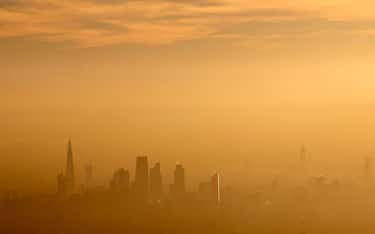 Aerial view South across city of London,air pollution, smog, Shard, towers,  London, UK