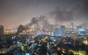 Smoke rises from a major apartment fire in Hanoi on May 24, 2024. A fire that ripped through a small apartment complex in central Hanoi early May 24 has killed at least 14 people and injured three others, police said. (Photo by AFP) (Photo by STR/AFP via Getty Images)