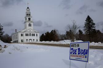 epa11090844 A sign reading 'Write in Joe Biden,' is posted in the snow outside the Acworth Congregational Church, in Acworth, New Hampshire, USA, 19 January 2024. The First in the Nation Primary is held on 23 January 2024.  EPA/CJ GUNTHER