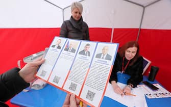 RUSSIA, REPUBLIC OF CRIMEA - MARCH 17, 2024: A candidates list is pictured during the 2024 Russian presidential election at a mobile polling station in the city of Bakhchisarai. Four candidates are on the ballot: Vladislav Davankov of the New People Party, incumbent president, independent candidate Vladimir Putin, Leonid Slutsky of the Liberal Democratic Party and Nikolai Kharitonov of the Russian Communist Party. Sergei Malgavko/TASS/Sipa USA