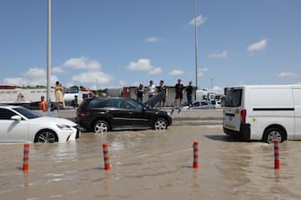 Stranded vehicles on a flooded highway after a rainstorm in Dubai, United Arab Emirates, on Wednesday, April 17, 2024. The United Arab Emirates experienced its heaviest downpour since records began in 1949, Dubai's media office said in a statement. Photographer: Christopher Pike/Bloomberg via Getty Images