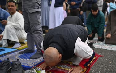 TURIN, ITALY - APRIL 10: Muslims pray during the Eid al-Fitr celebration on April 10, 2024 in Turin, Italy. The Muslim festival of Eid al-Fitr celebrates the end of the holy month of Ramadan and has been decreed as Wednesday 10th April. The dates of Eid al-Fitr are established on the final day of Ramadan following the crescent moon's arrival in Arab Islamic countries.  (Photo by Stefano Guidi/Getty Images)