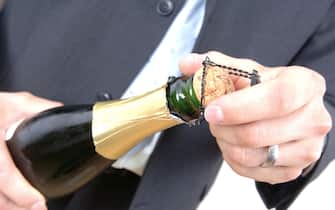 opening a champagne bottle