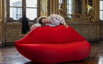 MILAN, ITALY - APRIL 15: An opera singer performs next to the "La bocca è mobile" installation by Gufram in Motion, exhibited at Palazzo Litta during the Milan Design Week 2024 on April 15, 2024 in Milan, Italy. Every year, the Salone Internazionale del Mobile and Fuorisalone define the Milan Design Week, the world’s largest annual furniture and design event. Centered on principles of circular economy, reuse, and sustainable practices and materials, the Fuorisalone’s 24 theme: “Materia Natura”, seeks to foster a culture of mindful design. (Photo by Emanuele Cremaschi/Getty Images)