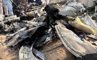 epa12171145 Debris at the site of a plane crash near Sardar Vallabhbhai Patel International Airport in Ahmedabad, Gujarat, western India, 12 June 2025. Air India flight AI171, bound for London carrying 242 passengers and crew members on board a Boeing 787-8 aircraft, crashed minutes after take-off in the Meghaninagar area of Ahmedabad.  EPA/SIDDHARAJ SOLANKI 88168