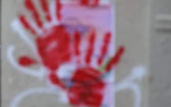 A picture shows red hand graffitis painted on buildings' walls of the Sainte-Croix de la Bretonnerie street, in the area where earlier the Holocaust memorial was vandalized with the same red hand prints in Paris, on May 14, 2024. A French Jewish organisation on May 14 condemned a "hateful rallying cry against Jews" and Paris authorities filed a criminal complaint after red hand graffiti was painted onto France's Holocaust Memorial. (Photo by Antonin UTZ / AFP) (Photo by ANTONIN UTZ/AFP via Getty Images)