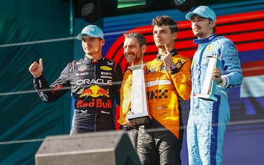 MIAMI INTERNATIONAL AUTODROME, UNITED STATES OF AMERICA - MAY 05: Max Verstappen, Red Bull Racing, 2nd position, Andrea Stella, Team Principal, McLaren F1 Team, Lando Norris, McLaren F1 Team, 1st position, and Charles Leclerc, Scuderia Ferrari, 3rd position, on the podium during the Miami GP at Miami International Autodrome on Sunday May 05, 2024 in Miami, United States of America. (Photo by Andy Hone / LAT Images)