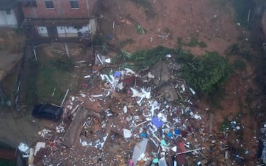 Aerial view showing rubble of houses destroyed due to heavy rains in Petropolis, Brazil, on March 23, 2024. A powerful storm has claimed at least nine lives in southeastern Brazil, particularly in the mountainous part of Rio de Janeiro state, where authorities on Saturday deployed rescue teams to deal with a "critical" situation. (Photo by Florian PLAUCHEUR / AFP) (Photo by FLORIAN PLAUCHEUR/AFP via Getty Images)