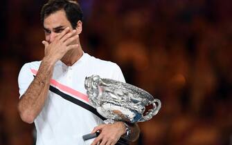 epa10185785 (FILE) - Winner Roger Federer of Switzerland reacts during the awarding ceremony of the men's final match at the Australian Open Grand Slam tennis tournament in Melbourne, Australia, 28 January 2018 (reissued 15 September 2022). Federer on 15 September 2022 released a statement reading that the Laver Cup held on 23-25 September in London will be his final ATP event to compete in.  EPA/LUKAS COCH AUSTRALIA AND NEW ZEALAND OUT *** Local Caption *** 54071000