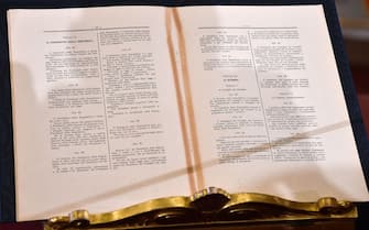 The Italian Constitution's articles that rule the government's functionalities and the President's powers are pictured at the desk of Italy's president prior to a new Cabinet swearing-in ceremony at the Quirinale presidential palace in Rome on September 5, 2019. - Prime Minister Giuseppe Conte on September 4 unveiled Italy's new government, a coalition of the anti-establishment Five Star Movement (M5S) and centre-left Democratic Party (PD). Conte, who remains at the helm after 14 months at the head of the outgoing populist government, presented 21 new ministers to be sworn in on September 5. (Photo by Andreas SOLARO / AFP)        (Photo credit should read ANDREAS SOLARO/AFP via Getty Images)