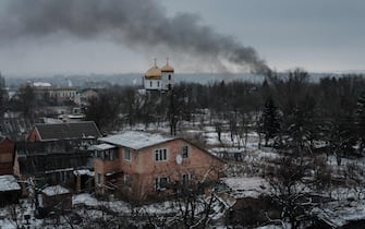(FILES) Black smoke rises after shelling in Bakhmut on February 3, 2023, amid the Russian invasion of Ukraine. Russia's private army Wagner claimed on May 20, 2023, the total control of the east Ukrainian city of Bakhmut, the epicentre of fighting, as Kyiv said the battle was continuing but admitted the situation was "critical". Bakhmut, a salt mining town that once had a population of 70,000 people, has been the scene of the longest and bloodiest battle in Moscow's more than year-long Ukraine offensive. The fall to Russia of Bakhmut, where both Moscow and Kyiv are believed to have suffered huge losses, would have high symbolic value. (Photo by YASUYOSHI CHIBA / AFP)