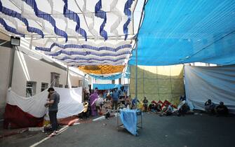 EDITORS NOTE: Graphic content / Displaced Palestinians take refuge in a tent at the gounds of Al-Shifa hopsital in Gaza City on October 29, 2023, amid continuing battles between Israel and the Palestinian Hamas movement. (Photo by Dawood NEMER / AFP) (Photo by DAWOOD NEMER/AFP via Getty Images)