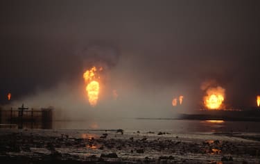 View of burning oil wells, Kuwait, 1991. (Photo by Allan Tannenbaum/Getty Images)