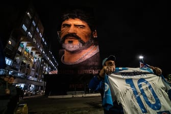 Fans celebrate Diego Armando Maradona's birthday, next to Jorit's mural, in Naples, Italy, 31 October 2021.
ANSA/CESARE ABBATE