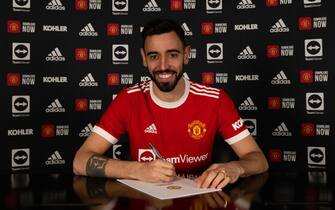 MANCHESTER, ENGLAND - APRIL 01: (EXCLUSIVE COVERAGE) Bruno Fernandes of Manchester United poses after signing a new contract extension with the club at Carrington Training Ground on April 01, 2022 in Manchester, England. (Photo by Ash Donelon/Manchester United via Getty Images)