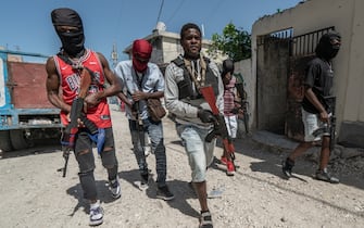 PORT-AU-PRINCE, HAITI - FEBRUARY 22: Gang Leader Jimmy 'Barbecue' Cherizier patrolling the streets with G-9 federation gang members in the Delmas 3 area on February 22, 2024, in Port-au-Prince, Haiti. There has a been fresh wave of violence in Port-au-Prince where, according to UN estimates, gangs control 80% of the city. (Photo by Giles Clarke/Getty Images)