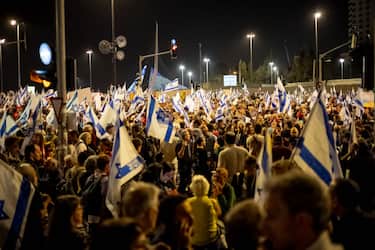Demonstrators march, beat drums, sing and wave Israeli flags in a demonstration for the kidnapping deal near the Knesset, on March 31, 2024, in Jerusalemm Israel. (Photo by Yahel Gazit / Middle East Images / Middle East Images via AFP)