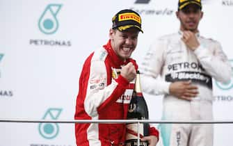Sepang International Circuit, Sepang, Kuala Lumpur, Malaysia.
Sunday 29 March 2015.
Sebastian Vettel, Ferrari, 1st Position, celebrates.
World Copyright: Glenn Dunbar/LAT Photographic.
ref: Digital Image _89P2219
