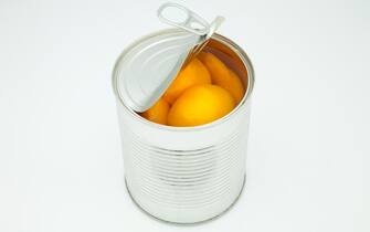 peach in conserve in a silver canister