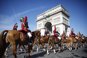 epa11477099 French cavalry arrive at the Arc de Triomphe during the Bastille Day military parade in Paris, France, 14 July 2024. France celebrates its national holiday, or Bastille Day, annually on 14 July to commemorate the storming of the Bastille fortress in 1789. The traditional military parade on the Champs Elysees is relocated to Foch Avenue due to the upcoming Paris 2024 Olympic Games.  EPA/YOAN VALAT / POOL