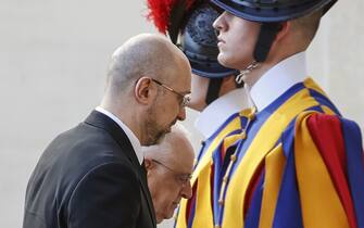 VATICAN CITY, VATICAN - APRIL 27: Ukrainian Prime Minister Denys Shmyhal (L), flanked by Monsignor Leonardo Sapienza (2nd L), arrives at St. Damaso courtyard for his audience with Pope Francis in Vatican City, Vatican, on April 27, 2023. (Photo by Riccardo De Luca/Anadolu Agency via Getty Images)