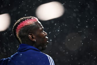 MANCHESTER, ENGLAND - SEPTEMBER 30:   Paul Pogba of Manchester United warms up ahead of the Premier League match between Manchester United and Arsenal FC at Old Trafford on September 30, 2019 in Manchester, United Kingdom. (Photo by Michael Regan/Getty Images)