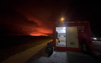 GRINDAVIK, ICELAND - DECEMBER 18: A volcano erupts on the Reykjanes Peninsula near the power station on December 18, 2023 north of Grindavik, Iceland. (Photo by Micah Garen/Getty Images)