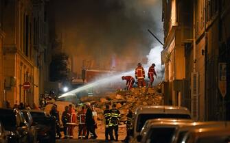 Rescue personnel work at the scene where a building collapsed in the southern French port city of Marseille  early on April 9, 2023. - A building in the southern French port city of Marseille collapsed, police told AFP early on April 9, though it was unclear whether there were any victims. (Photo by NICOLAS TUCAT / AFP) / The erroneous mention[s] appearing in the metadata of this photo by NICOLAS TUCAT has been modified in AFP systems in the following manner: [April 9] instead of [March 9]. Please immediately remove the erroneous mention[s] from all your online services and delete it (them) from your servers. If you have been authorized by AFP to distribute it (them) to third parties, please ensure that the same actions are carried out by them. Failure to promptly comply with these instructions will entail liability on your part for any continued or post notification usage. Therefore we thank you very much for all your attention and prompt action. We are sorry for the inconvenience this notification may cause and remain at your disposal for any further information you may require. (Photo by NICOLAS TUCAT/AFP via Getty Images)