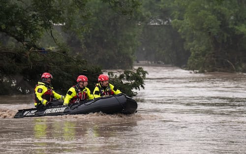 COMFORT, TEXAS - JULY 04: Boerne Search and Rescue teams navigate upstream in an inflatable boat on the flooded Guadalupe River on July 4, 2025 in Comfort, Texas. Heavy rainfall caused flooding along the Guadalupe River in central Texas with multiple fatalities reported. (Photo by Eric Vryn/Getty Images)