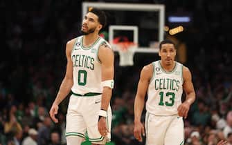 BOSTON, MASSACHUSETTS - MAY 17: Jayson Tatum #0 and Malcolm Brogdon #13 of the Boston Celtics walk backcourt during the fourth quarter of game one of the Eastern Conference Finals against the Miami Heat at TD Garden on May 17, 2023 in Boston, Massachusetts. NOTE TO USER: User expressly acknowledges and agrees that, by downloading and or using this photograph, User is consenting to the terms and conditions of the Getty Images License Agreement. (Photo by Adam Glanzman/Getty Images)