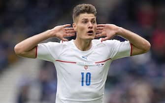 epa09270578 Patrik Schick of the Czech Republic celebrates after scoring his team's second goal during the UEFA EURO 2020 group D preliminary round soccer match between Scotland and the Czech Republic in Glasgow, Britain, 14 June 2021.  EPA/Petr Josek / POOL (RESTRICTIONS: For editorial news reporting purposes only. Images must appear as still images and must not emulate match action video footage. Photographs published in online publications shall have an interval of at least 20 seconds between the posting.)