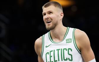 ORLANDO, FLORIDA - NOVEMBER 24: Kristaps Porzingis #8 of the Boston Celtics looks on against the Orlando Magic during the first half at Amway Center on November 24, 2023 in Orlando, Florida. User expressly acknowledges and agrees that, by downloading and/or using this Photograph, user is consenting to the terms and conditions of the Getty Images License Agreement. (Photo by Rich Storry/Getty Images)
