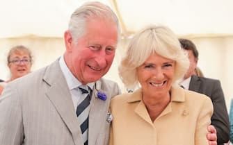 SIMONSBATH, ENGLAND - JULY 17: Camilla, Duchess of Cornwall is sung Happy Birthday by Prince Charles, Prince of Wales and the crowds gathered at the National Parks ‘Big Picnic’ celebration in honour of all 15 of the UK’s National Parks, during an official visit to Devon & Cornwall on July 17, 2019 in Simonsbath, England. Held in Exmoor National Park the picnic marks 70 years since they were created by the 1949 National Parks and Access to the Countryside Act. (Photo by Chris Jackson/Getty Images)
