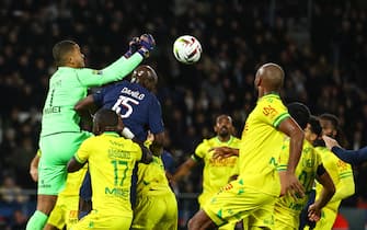 epa11020329 FC Nantes' Goalkepper Alban Lafont (L) and Paris Saint Germain's Danilo Pereira (C-L) in action during the French Ligue 1 soccer match between PSG and FC Nantes, in Paris, France, 09 December 2023.  EPA/Mohammed Badra