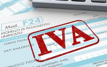 close up view of F24 form for italian taxes,the word iva and an electronic calculator (3d render)