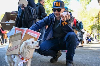 NEW YORK, NEW YORK - OCTOBER 22: A person dressed as an FBI agent and his dog dressed as Top Secret documents Donald Trump took from the White House participate in the 32nd Annual Tompkins Square Halloween Dog Parade on October 22, 2022 in New York City. The parade returned to Tompkins Square Park after being relocated last year.  (Photo by Alexi Rosenfeld/Getty Images)