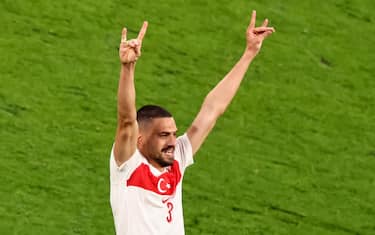 epa11454372 Merih Demiral of Turkey celebrates after scoring his 0-2 second goal during the UEFA EURO 2024 Round of 16 soccer match between Austria and Turkey, in Leipzig, Germany, 02 July 2024 (issued 03 July 2024). The UEFA on 03 July 2024 opened an investigation into "alleged inappropriate behaviour" for the so-called 'wolf salute' Demiral gestured, a gesture associated with the far-right nationalist group Grey Wolves.  EPA/HANNIBAL HANSCHKE