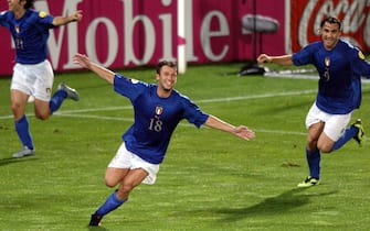 epa000217986 Italian player Antonio Cassano (C) celebrates with team-mates Andrea Pirlo (L) and Christian Vieri after scoring during the EURO 2004 Group C match between Italy and Bulgaria at the stadium D. Afonso Henriques in Guimaraes on Tuesday, 22 June 2004. Cassano scored the last minute 2-1 winning goal only to find out that it is not enough for Italy to qualify for the quarter finals.  EPA/OLIVER BERG NO MOBILE PHONE APPLICATIONS