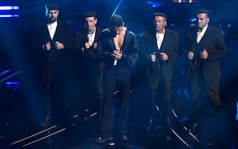 Italian singer Mahmood with Tenores di Bitti perform on stage at the Ariston theatre during the 74th Sanremo Italian Song Festival, Sanremo, Italy, 09 February 2024. The music festival will run from 06 to 10 February 2024. ANSA/RICCARDO ANTIMIANI