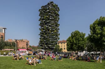 MILAN, ITALY - MAY 27: People sunbathe while sitting on deck chairs at BAM - Biblioteca degli Alberi Milano park on May 27, 2023 in Milan, Italy. (Photo by Emanuele Cremaschi/Getty Images)