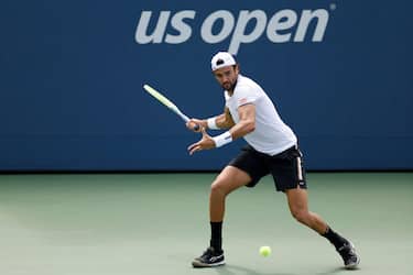 NEW YORK, NEW YORK - AUGUST 29: Matteo Berrettini of Italy returns a shot against Ugo Humbert of France during their Men's Singles First Round match on Day Two of the 2023 US Open at the USTA Billie Jean King National Tennis Center on August 29, 2023 in the Flushing neighborhood of the Queens borough of New York City. (Photo by Sarah Stier/Getty Images)