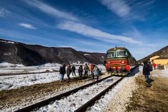 A view of the historic train on the Trans-Siberian railway of Italy, in Palena, on January 15, 2023. The Trans-Siberian Railway of Italy, also known as the Railway of the Parks, is a railway route in Italy that is known for its scenic views. It passes through medieval villages, natural landscapes, and offers views of various landscapes in motion. The railway is considered a masterpiece of railway engineering, and is known for its technical characteristics such as slopes of 28%. (Photo by Manuel Romano/NurPhoto via Getty Images)