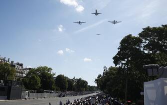 epa11477107 French Air Force planes fly in formation during the Bastille Day military parade in Paris, France, 14 July 2024. France celebrates its national holiday, or Bastille Day, annually on 14 July to commemorate the storming of the Bastille fortress in 1789. The traditional military parade on the Champs Elysees is relocated to Foch Avenue due to the upcoming Paris 2024 Olympic Games.  EPA/YOAN VALAT