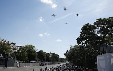 epa11477107 French Air Force planes fly in formation during the Bastille Day military parade in Paris, France, 14 July 2024. France celebrates its national holiday, or Bastille Day, annually on 14 July to commemorate the storming of the Bastille fortress in 1789. The traditional military parade on the Champs Elysees is relocated to Foch Avenue due to the upcoming Paris 2024 Olympic Games.  EPA/YOAN VALAT