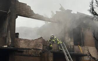 KYIV, UKRAINE - JANUARY 18: (----EDITORIAL USE ONLY â MANDATORY CREDIT - "UKRANIAN PRESIDENCY / HANDOUT" - NO MARKETING NO ADVERTISING CAMPAIGNS - DISTRIBUTED AS A SERVICE TO CLIENTS----) Firefighters work on the site where a helicopter crashed in the Brovary city of Ukraineâs Kyiv region on January 18, 2023. Killed at least 16 people, including the countryâs interior minister, his first deputy minister, and the state secretary. (Photo by Ukrainian Presidency/Handout/Anadolu Agency via Getty Images)