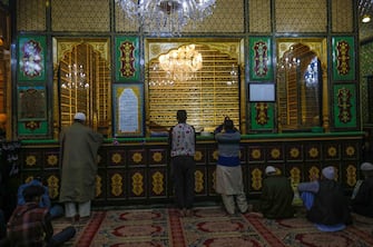 epa11263382 Muslims pray during special night prayers on the 27th night of the holy fasting month of Ramadan, known as 'Shab-e-Qadr' or 'Laylat Al Qadr,' at the shrine of Muslim preacher and Sufi saint Sheikh Syed Abdul Qadir Jeelani in Srinagar, the summer capital of Indian Kashmir, 07 April 2024. The Muslims' holy month of Ramadan is the ninth month in the Islamic calendar and it is believed that the revelation of the first verse in the Koran was during its last 10 nights. It is celebrated yearly by praying during the night time and abstaining from eating, drinking, and sexual acts during the period between sunrise and sunset. It is also a time for socializing, mainly in the evening after breaking the fast and a shift of all activities to late in the day in most countries.  EPA/FAROOQ KHAN