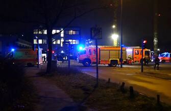 epa10512750 Emergency workers and police gather at the scene of a shooting in Hamburg, Germany, 09 March 2023. According to police, the shooting took place around 9 pm, killing seven people and injuring at least eight others. The gunman is believed to be among the several dead found in the building, police said.  EPA/NEWS5     BEST QUALITY AVAILABLE