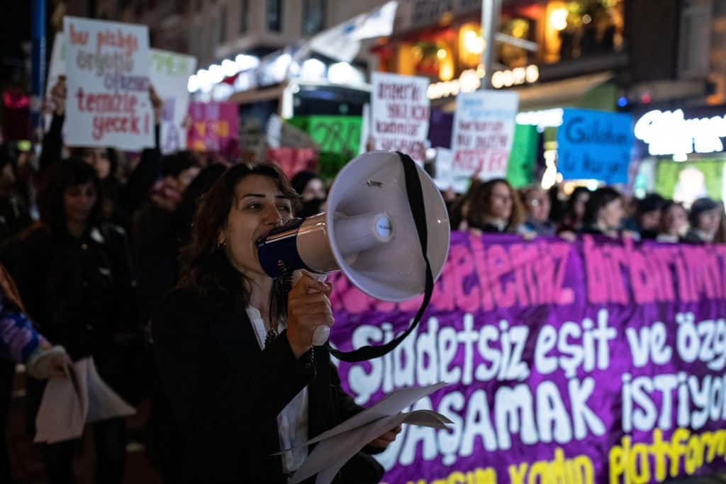 ISTANBUL, TURKEY - 2024/10/19: A woman chants slogans on a megaphone during the rally against violence against women and femicide. (Photo by Onur Dogman/SOPA Images/LightRocket via Getty Images)